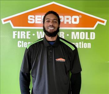 Photo of man in front of Servpro logo